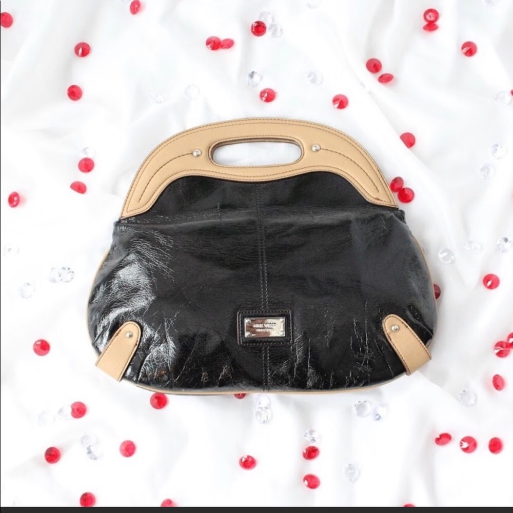 Nine West Black and Tan vegan leather purse.